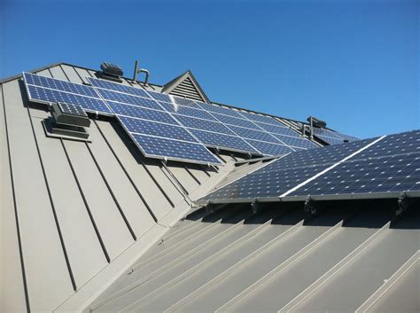 house with solar panels on standing seam metal roof|metal roof solar panel mounting.